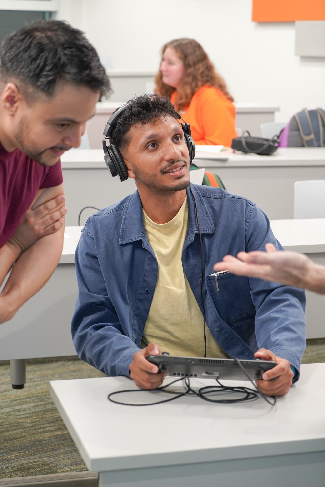 Player interacting with a game during the NERDLab Arcade
