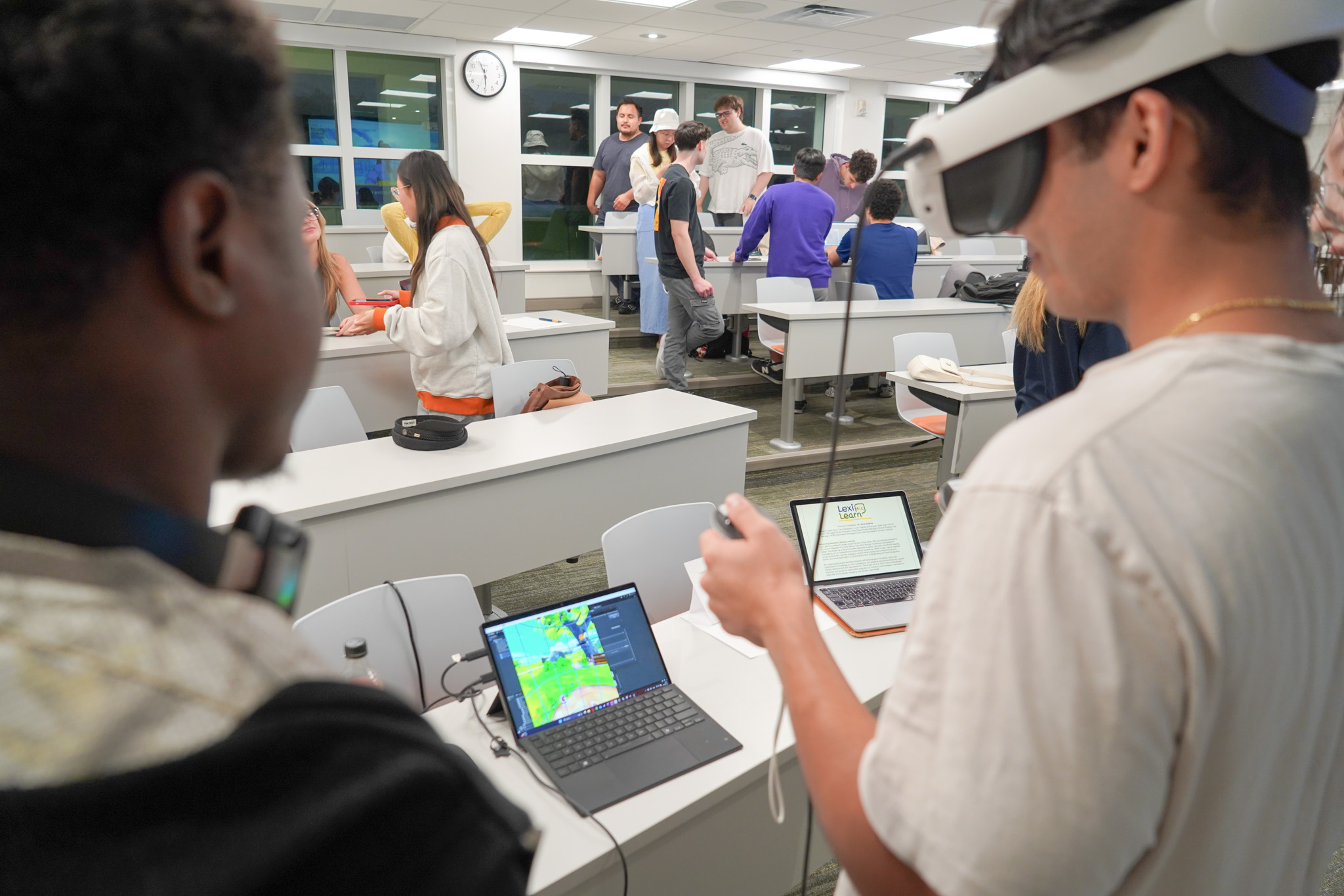 Multiple players engaging with different games at the NERDLab Arcade